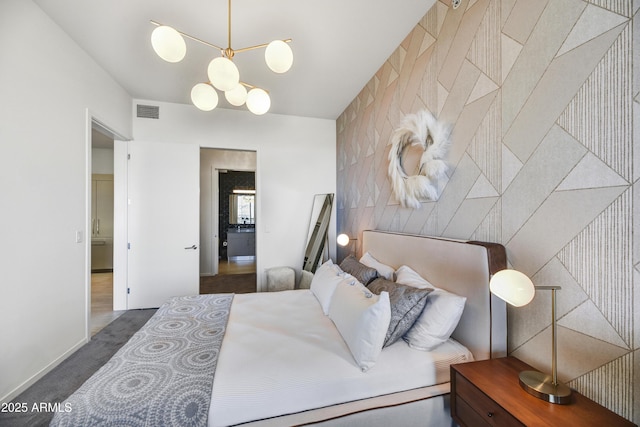 carpeted bedroom with a notable chandelier