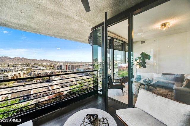 balcony featuring a mountain view