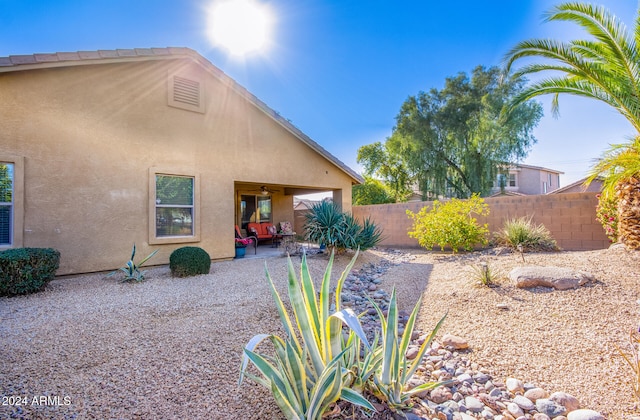 exterior space featuring a patio area and ceiling fan