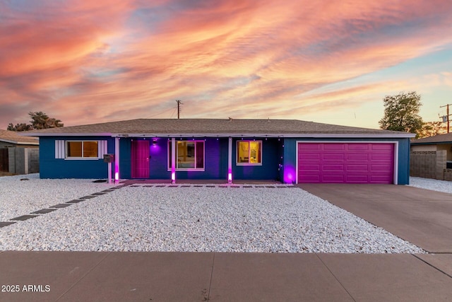 ranch-style home featuring driveway and an attached garage