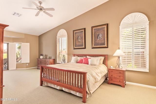 bedroom featuring baseboards, visible vents, carpet flooring, and vaulted ceiling