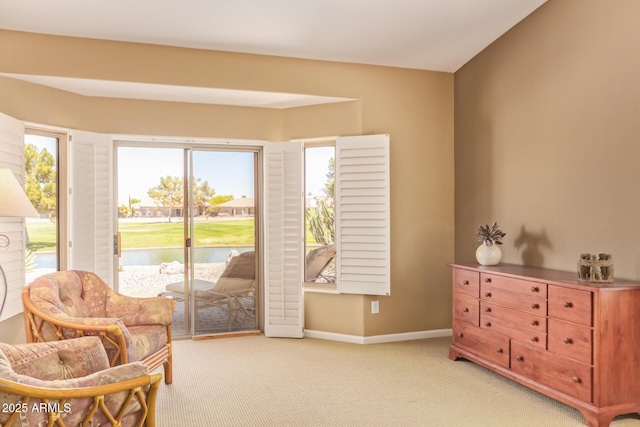sitting room with light colored carpet and baseboards