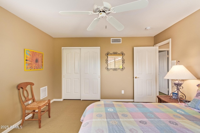 carpeted bedroom with a closet, visible vents, a ceiling fan, and baseboards