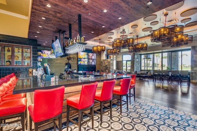bar with wood ceiling, wood finished floors, a dry bar, and recessed lighting