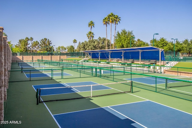 view of sport court with fence