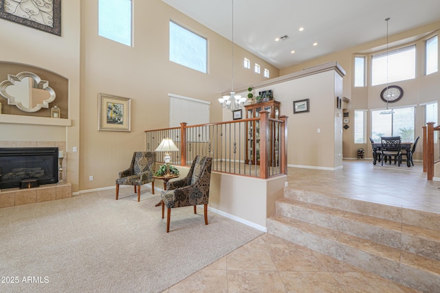 21841 N Ingram Ct, Maricopa, AZ 85138 - stairway with a towering ceiling, a chandelier, a fireplace, baseboards, and recessed lighting