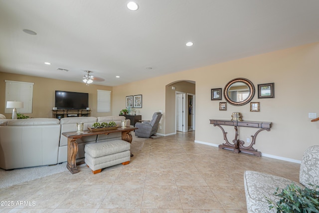 21841 N Ingram Ct, Maricopa, AZ 85138 - living room with arched walkways, a ceiling fan, baseboards, recessed lighting, and light tile patterned flooring