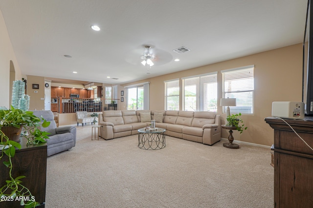 21841 N Ingram Ct, Maricopa, AZ 85138 - living room featuring carpet flooring, a ceiling fan, arched walkways, recessed lighting, and baseboards