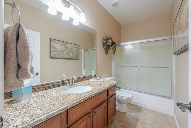21841 N Ingram Ct, Maricopa, AZ 85138 - bathroom with toilet, vanity, combined bath / shower with glass door, and tile patterned flooring