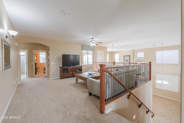 21841 N Ingram Ct, Maricopa, AZ 85138 - living area featuring arched walkways, plenty of natural light, and baseboards