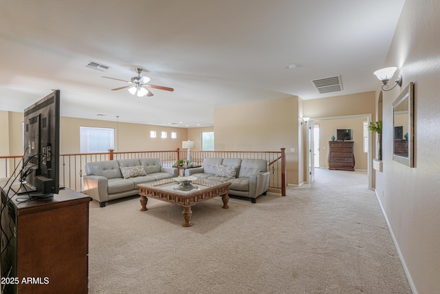 21841 N Ingram Ct, Maricopa, AZ 85138 - living area featuring light colored carpet, ceiling fan, and baseboards