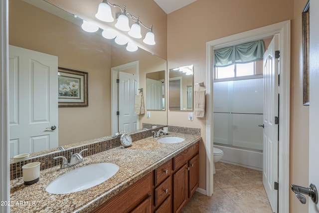 21841 N Ingram Ct, Maricopa, AZ 85138 - bathroom with toilet, double vanity, combined bath / shower with glass door, and tile patterned floors