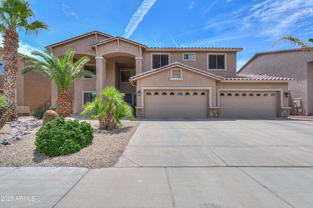 21841 N Ingram Ct, Maricopa, AZ 85138 - mediterranean / spanish-style home with driveway, a garage, stucco siding, stone siding, and a tiled roof