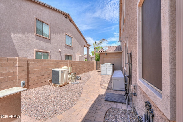 21841 N Ingram Ct, Maricopa, AZ 85138 - fenced backyard with central air condition unit and a patio
