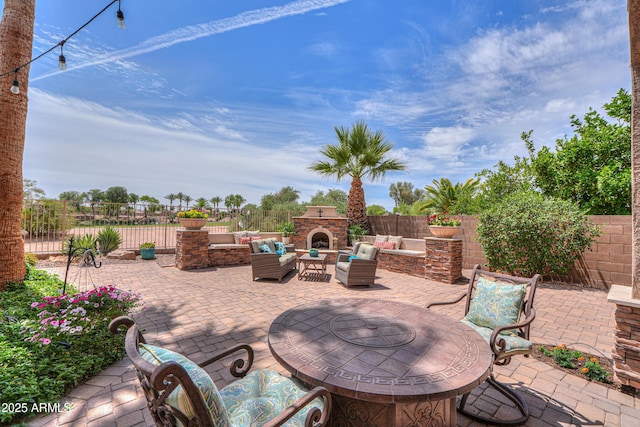 21841 N Ingram Ct, Maricopa, AZ 85138 - fenced backyard featuring a patio area and an outdoor living space with a fireplace