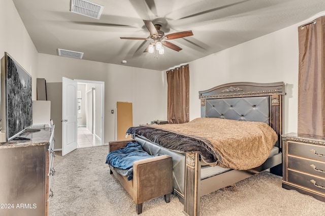 bedroom with a ceiling fan, carpet flooring, and visible vents