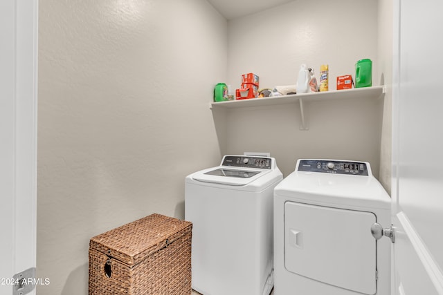 laundry area with independent washer and dryer