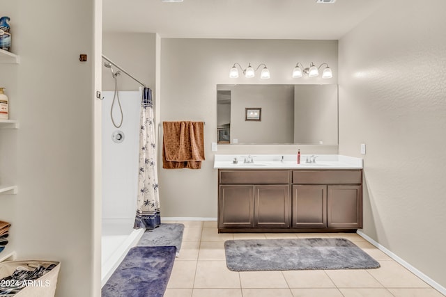 bathroom with tile patterned flooring, vanity, and a shower with curtain