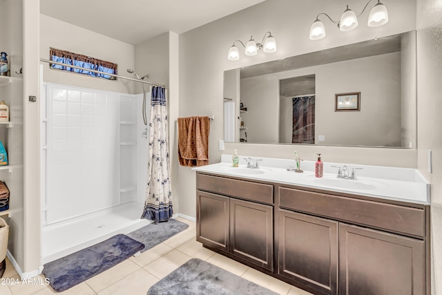 bathroom with vanity, tile patterned flooring, and curtained shower