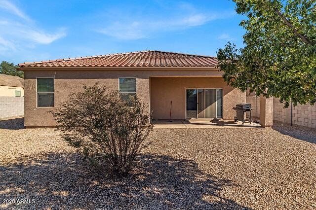 back of property with a patio area