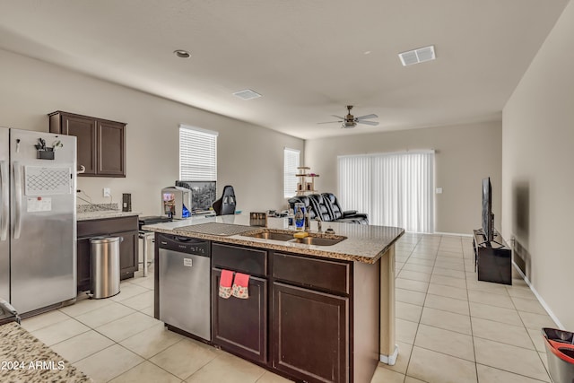 kitchen featuring a sink, light tile patterned flooring, visible vents, and appliances with stainless steel finishes