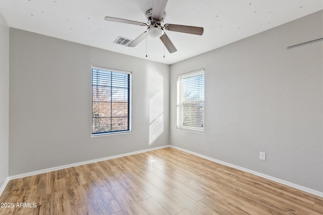 unfurnished room featuring ceiling fan and light hardwood / wood-style flooring