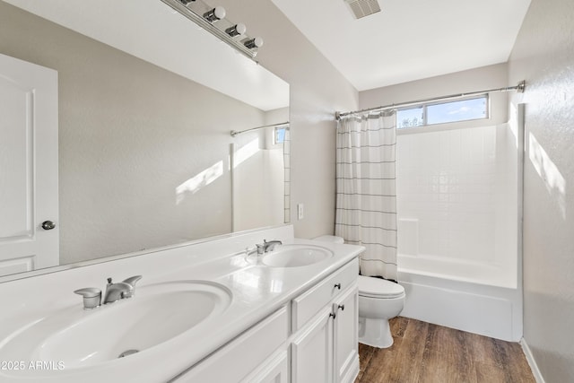 full bathroom with shower / bathtub combination with curtain, vanity, toilet, and wood-type flooring