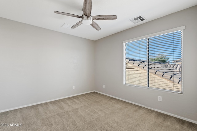 carpeted empty room with ceiling fan