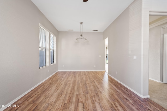 unfurnished dining area with wood-type flooring