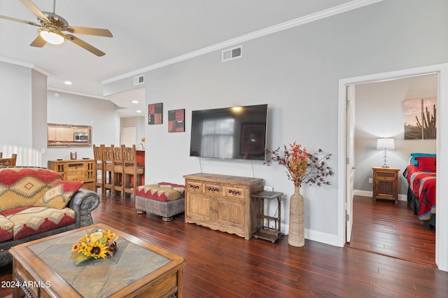 living room featuring ornamental molding, dark hardwood / wood-style floors, and ceiling fan