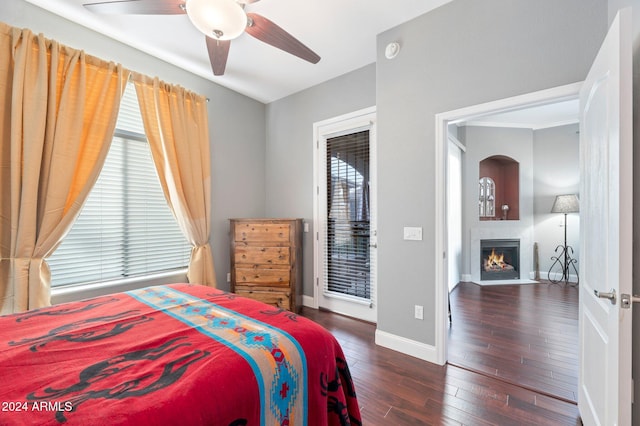 bedroom featuring ceiling fan and dark hardwood / wood-style floors