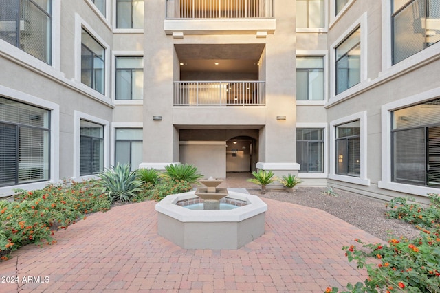 view of patio featuring a balcony