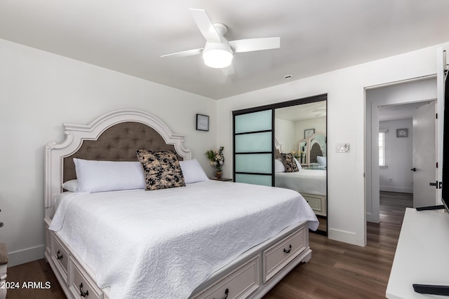 bedroom with ceiling fan and dark hardwood / wood-style floors