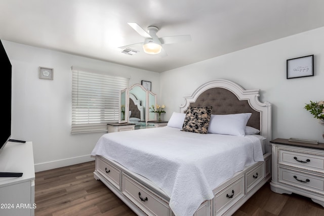 bedroom featuring dark hardwood / wood-style floors and ceiling fan