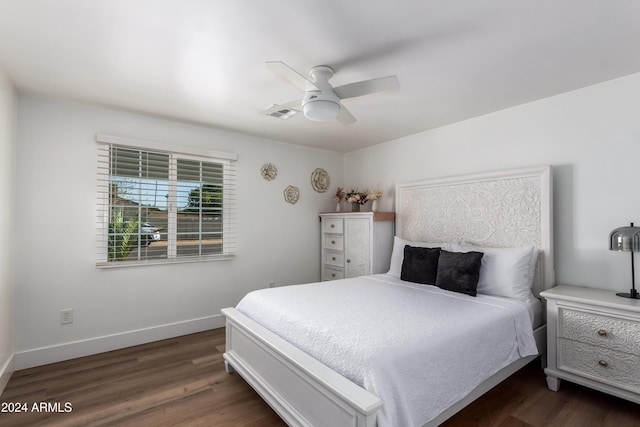 bedroom featuring ceiling fan and dark hardwood / wood-style floors