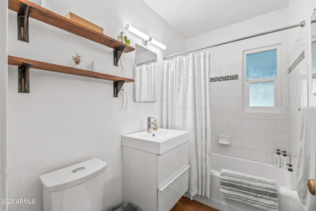 full bathroom with shower / bath combo with shower curtain, vanity, and toilet