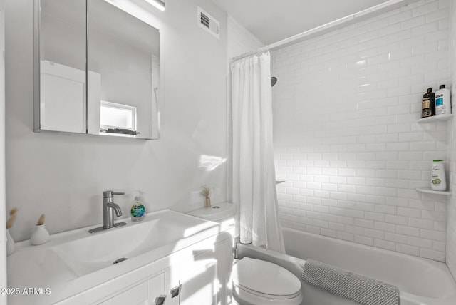 full bathroom with shower / bath combination with curtain, vanity, and toilet