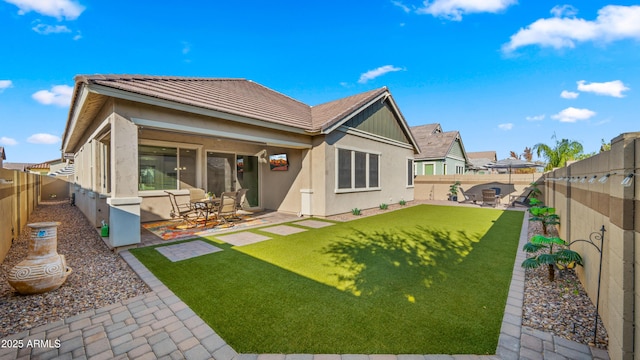 4341 E Evelyn St, Gilbert, AZ 85295 - back of house with stucco siding, a patio, and a fenced backyard