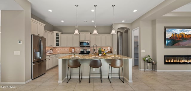 4341 E Evelyn St, Gilbert, AZ 85295 - kitchen with appliances with stainless steel finishes, decorative backsplash, light tile patterned flooring, recessed lighting, and glass insert cabinets