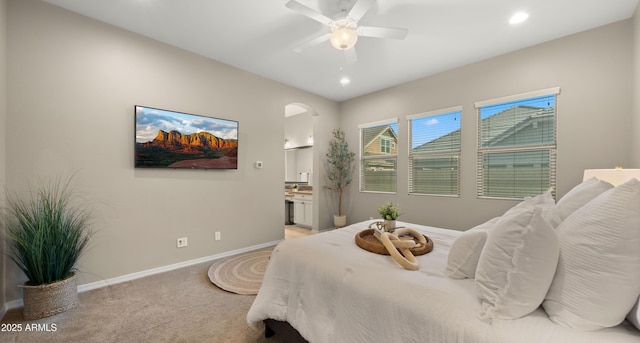 4341 E Evelyn St, Gilbert, AZ 85295 - bedroom with light carpet, arched walkways, connected bathroom, recessed lighting, and a ceiling fan
