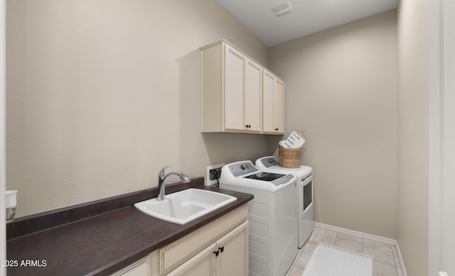 4341 E Evelyn St, Gilbert, AZ 85295 - washroom with cabinet space, washer and dryer, and light tile patterned floors