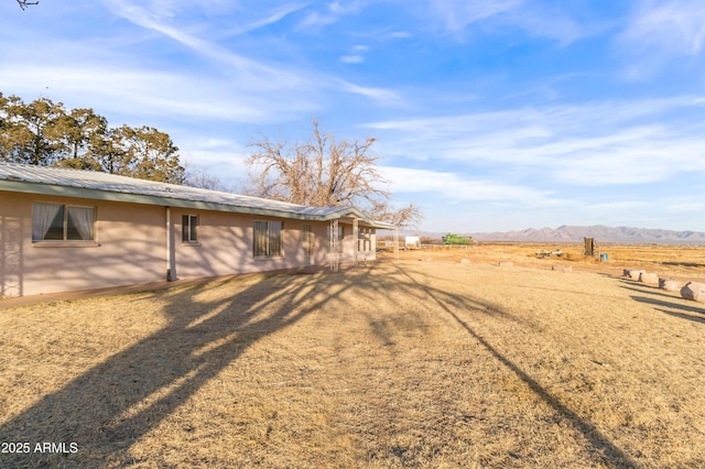 view of yard featuring a mountain view and a rural view