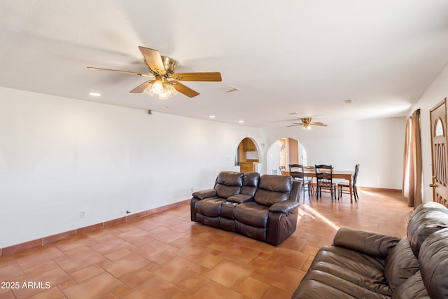 living room featuring ceiling fan