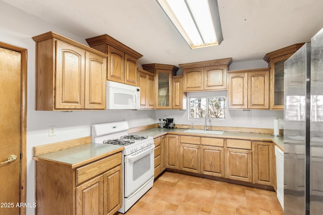 kitchen with sink and white appliances