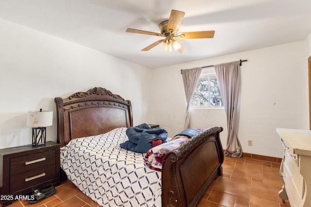 bedroom with tile patterned floors and ceiling fan