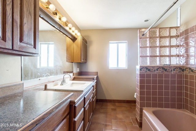 bathroom featuring vanity and a wealth of natural light