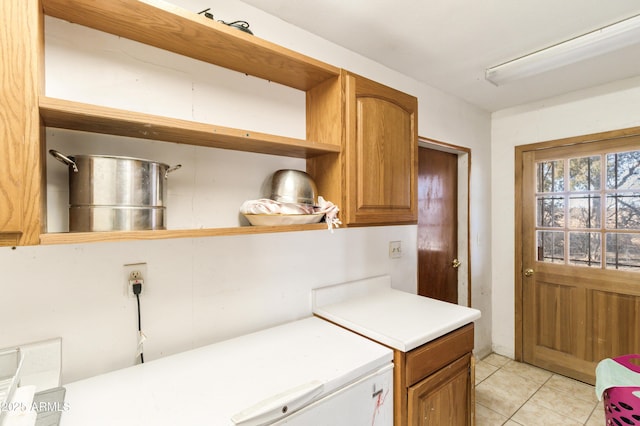 kitchen with light tile patterned flooring