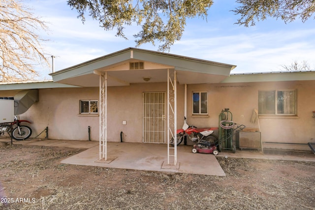 rear view of property with a patio area