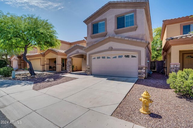 view of front of home with a garage