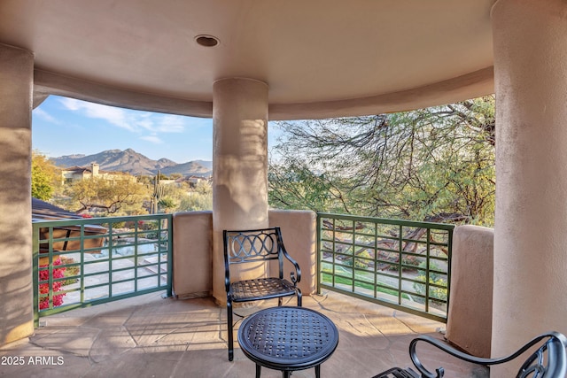 balcony featuring a mountain view